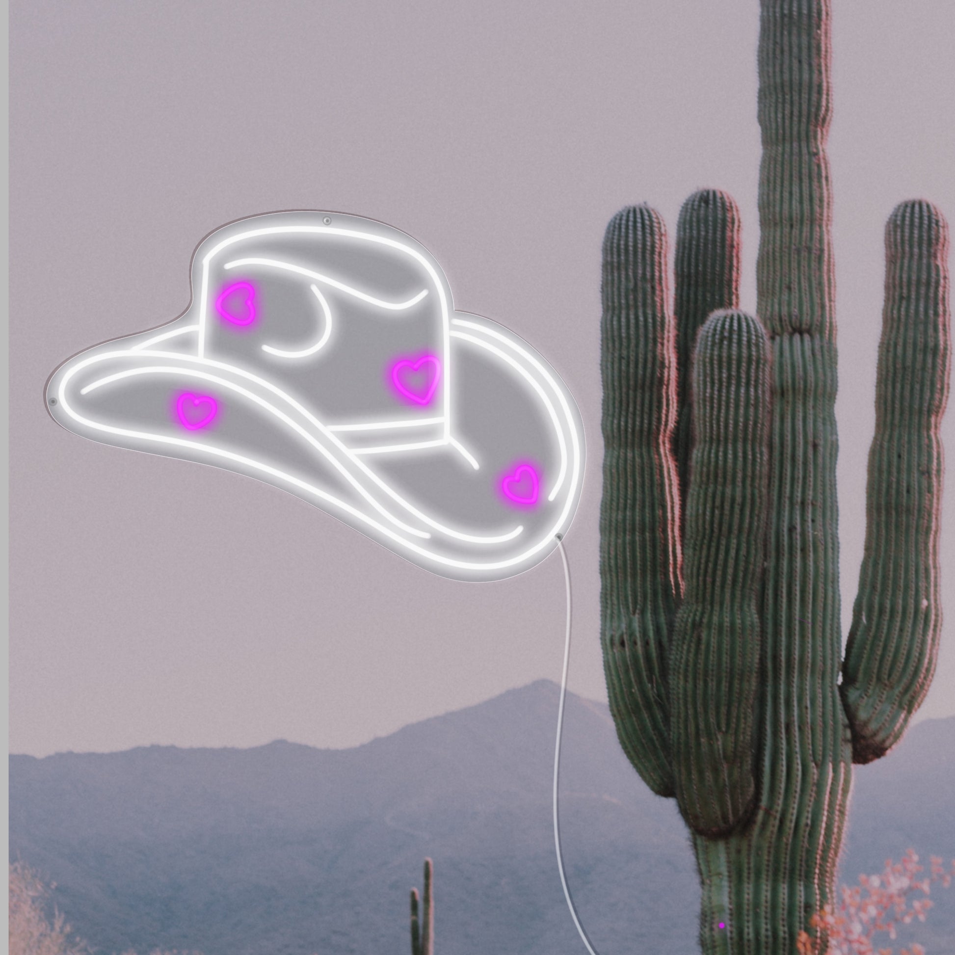 A vibrant neon sign shaped like a classic cowgirl hat, radiating a Western charm, perfect for themed weddings and events embracing the 2024 trend