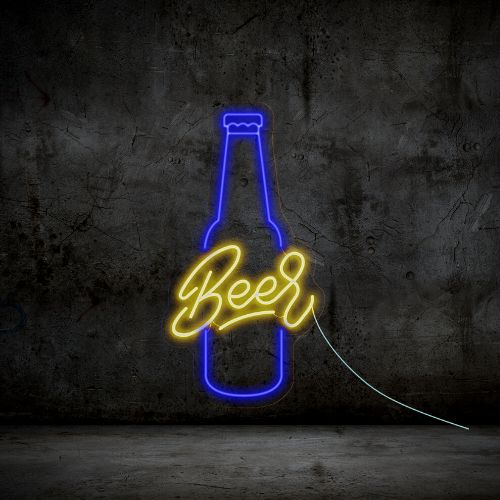 A neon beer bottle sign illuminating a dark room with brick walls in the background